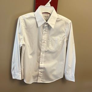 Long sleeved button down white shirt. Great for Spring concerts!